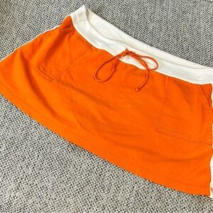BCNY orange cotton mini skirt with shorts built in. Size XL